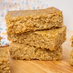 Three Easy Flapjacks Recipe bars stacked up on a wooden board